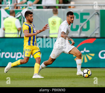 Budapest, Hungary. 12th July, 2018. (r-l) Davide Lanzafame of Ferencvarosi TC wins the ball from Dor Micha of Maccabi Tel Aviv FC during the UEFA Europa League First Qualifying Round 1st Leg match between Ferencvarosi TC and Maccabi Tel Aviv FC at Groupama Arena on July 12, 2018 in Budapest, Hungary. Credit: Laszlo Szirtesi/Alamy Live News Stock Photo