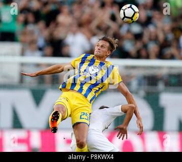 Budapest, Hungary. 12th July, 2018. (l-r) Aaron Schoenfeld of Maccabi Tel Aviv FC battles for the ball in the air with Stefan Spirovski of Ferencvarosi TC during the UEFA Europa League First Qualifying Round 1st Leg match between Ferencvarosi TC and Maccabi Tel Aviv FC at Groupama Arena on July 12, 2018 in Budapest, Hungary. Credit: Laszlo Szirtesi/Alamy Live News Stock Photo