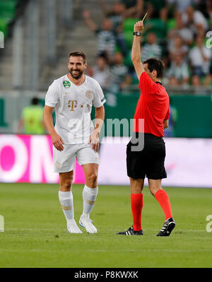Budapest, Hungary. 12th July, 2018. (r-l) Referee Ricardo De Burgos shows the yellow card for Daniel Bode of Ferencvarosi TC during the UEFA Europa League First Qualifying Round 1st Leg match between Ferencvarosi TC and Maccabi Tel Aviv FC at Groupama Arena on July 12, 2018 in Budapest, Hungary. Credit: Laszlo Szirtesi/Alamy Live News Stock Photo