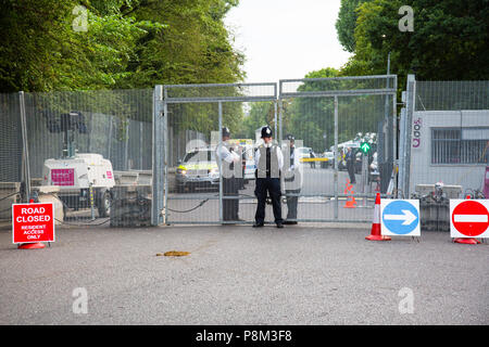 London, UK. 12th July, 2018. Protesters gathered near Winfield House in Regent's Park, the residence of the United States ambassador, to await the arrival of President Trump who is on a visit to the UK.  There were tight security measures in place, with the road in front of the house closed to the public, security fencing encircling the property and a heavy police presence. London, UK. 12th July 2018. Credit: Redorbital Photography/Alamy Live News Stock Photo