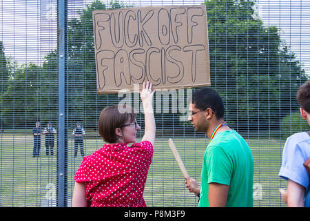 London, UK. 12th July, 2018. Protesters gathered near Winfield House in Regent's Park, the residence of the United States ambassador, to await the arrival of President Trump who is on a visit to the UK.  There were tight security measures in place, with the road in front of the house closed to the public, security fencing encircling the property and a heavy police presence. London, UK. 12th July 2018. Credit: Redorbital Photography/Alamy Live News Stock Photo