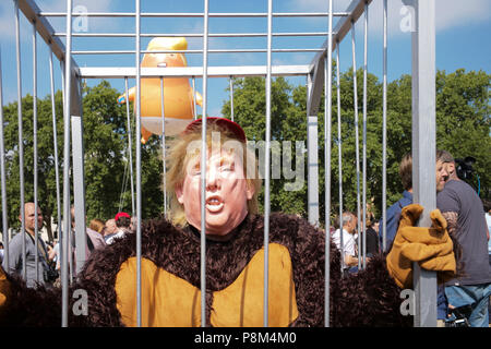 London, UK. 13th July, 2018. A huge blimp portraying US President Donald Trump as a baby is floated during a protest in Parliament Square this morning. Credit: Joshua Preston/Alamy Live News Stock Photo