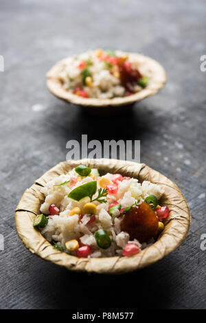 GopalKala or Dahi Kala is a prasad offered to lord Krishna on Janmashtami or Gokulashtami. Made using beaten rice, curd/milk, sugar, pomegranate Stock Photo