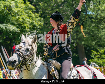 Medieval jousting, Linlithgow Palace, Scotland, UK.  HES summer entertainment by Les Amis D'Onno equine stunt team archery performer Stock Photo