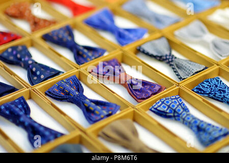 Rows of colorful bow-ties in boxes Stock Photo