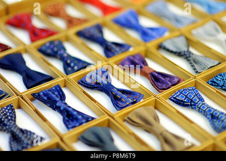 Rows of colorful bow-ties in boxes Stock Photo