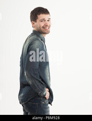 side view of smiling stylish young guy is looking forward to the Stock Photo
