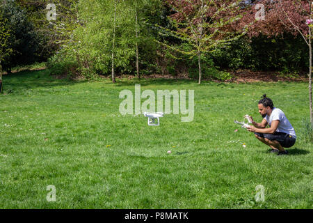 A man flying his drone in a Crystal Palace park, London, England Stock Photo