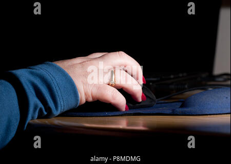 lady hand hold mouse Stock Photo