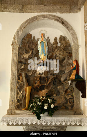 Virgen of Lourdes statue and wax body parts in chapel on Monte do Calvario, Vila Praia de Ancora, Minho Province, northern Portugal Stock Photo