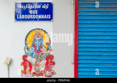 Pondicherry, India - March 17, 2018: Wall art depicting the Hindu god Ganesh under a street plaque in the former French colony on the Tamil Nadu coast Stock Photo