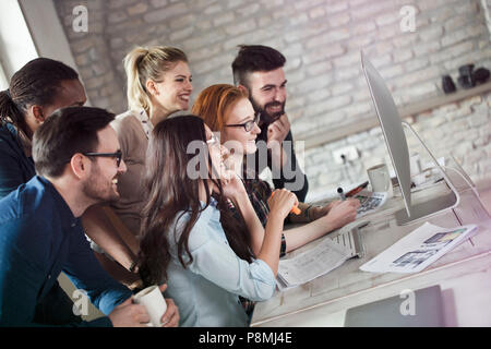 Group of young designers working as team Stock Photo