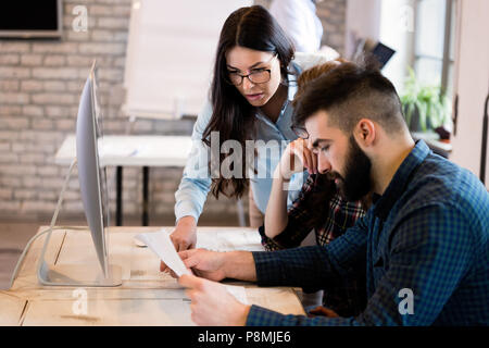 Young architects working on project in office Stock Photo