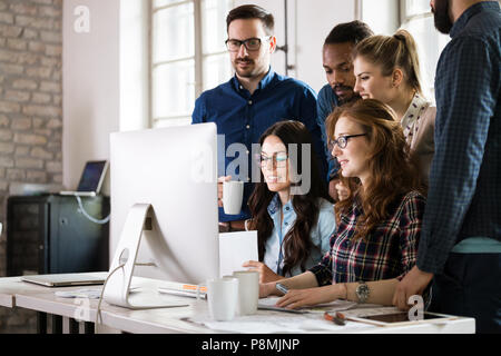 Young architects working on project in office Stock Photo