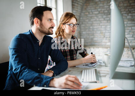 Young architects working on project in office Stock Photo
