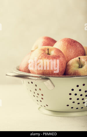 Fresh apples in metal strainer Stock Photo