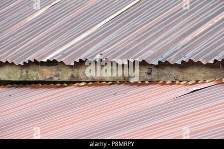 Old rusty galvanized roof during raining Stock Photo