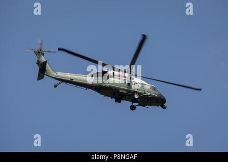 Marine One flies over a temporary perimeter fence encircling Winfield House, the official residence of the US Ambassador during the visit to the UK of US President, Donald Trump, on 12th July 2018, in Regent's Park, London, England. Stock Photo