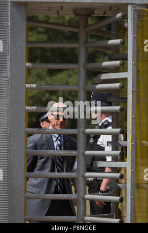 American Secret Service and UK police guard a temporary perimeter fence encircling Winfield House, the official residence of the US Ambassador during the visit to the UK of US President, Donald Trump, on 12th July 2018, in Regent's Park, London, England. Stock Photo