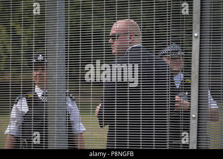 American Secret Service and UK police guard a temporary perimeter fence encircling Winfield House, the official residence of the US Ambassador during the visit to the UK of US President, Donald Trump, on 12th July 2018, in Regent's Park, London, England. Stock Photo