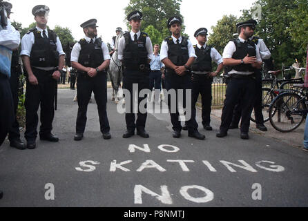 Police officers prepare for the demonstrators outside the US ambassador residence in Regent's Park London, as part of the protests against the visit of US President Donald Trump to the UK. Stock Photo