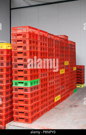 empty plastic crates, stacked in a pile Stock Photo