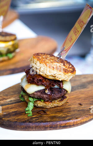 Ramen burger at a food stall in the Greenwich Market, London, UK Stock Photo