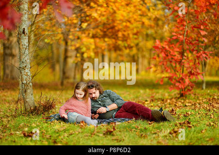 Father and daughter on beautiful autumn day Stock Photo