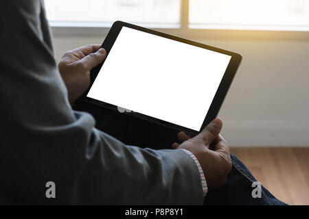 Digital tablet computer close up man using tablet hands man multitasking with isolated screen Stock Photo