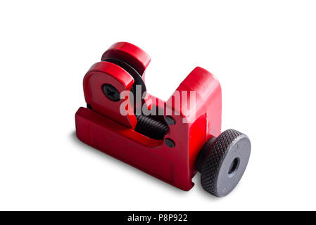 Isolated red metal pipe cutter for cutting lengths of tubing for plumbing standing diagonally on white with copy space Stock Photo