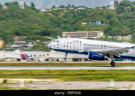 Montego Bay, Jamaica - June 06 2015: JetBlue aircraft taking off from Sangster International Airport (MBJ) in Montego Bay, Jamaica. Stock Photo