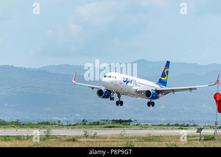 Montego Bay, Jamaica - June 06 2015: Spirit Airlines aircraft landing at the Sangster International Airport (MBJ) in Montego Bay, Jamaica. Stock Photo