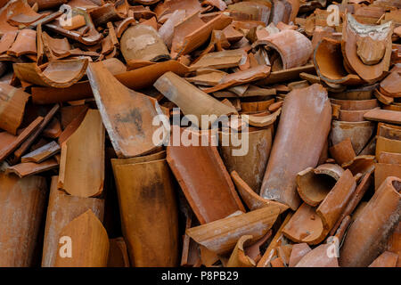 Pile of broken terracotta clay pipes provide interesting textured background Stock Photo