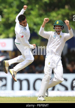 South African bowler Tabraiz Shamsi (L) celebrating the wicket  with team mates during day 1 of the 1st Test match between Sri Lanka and South Africa at Galle International Stadium on July 12, 2018 in Galle, Sri Lanka. (Photo by Lahiru Harshana / Pacific Press) Stock Photo