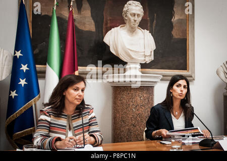 Rome, Italy. 12th July, 2018. ROME, ITALY - JULY 12. Virginia Raggi, Mayor of Rome with Rosalba Castiglione, Councillor for Heritage and Housing Policies during the Press Conference of the Mayor of Rome Virginia Raggi, Presentation of the redefinition of the plan of action on leases relating to the available assets for residential use of Roma Capitale.on July 12, 2018 in Rome, Italy Credit: Andrea Ronchini/Pacific Press/Alamy Live News Stock Photo