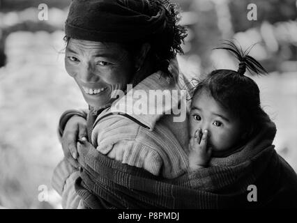 MOTHER and CHILD in the village of SAMDO on the AROUND MANASLU TREK - NUPRI REGION, NEPAL Stock Photo