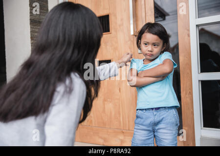 portrait of young mother persuaded her daughter. child behaviour problem Stock Photo