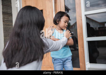 portrait of young mother persuaded her daughter. child behaviour problem Stock Photo