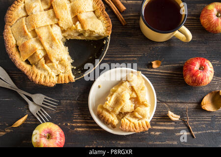 Classic Apple Pie Dessert with lattice. Piece of homemade American Pie from Organic Apples. Stock Photo