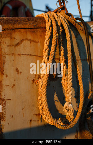Old sling cable of an electric winch in front of 4x4 car Stock Photo ...