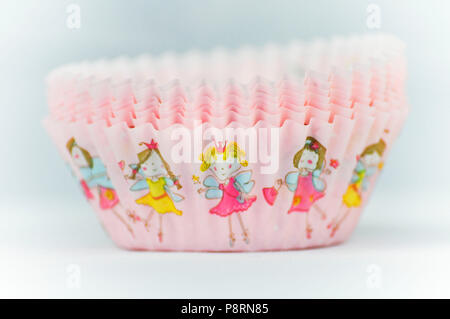 Pink bun cases with fairies Stock Photo