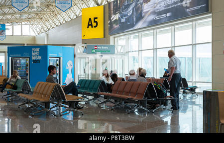Amsterdam,Holland,14-April-2018:People in the waiting room of the airport Schiphol waiting for the flight at the gate A5,Schiphol is the airport from Holland Stock Photo