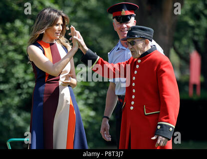 First lady Melania Trump high fives a child on the South Lawn of the ...