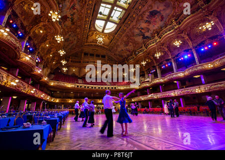 UK, England, Lancashire, Blackpool, Blackpool Tower Ballroom, dancers in ornate interior Stock Photo
