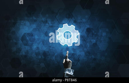Technology conceptual image with gear digital symbol on dark background Stock Photo