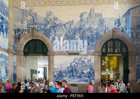 The railway station in Aveiro, Portugal with its celebrated blue tiles (Azulejos) illustrating Portuguese life and history around the walls. Stock Photo