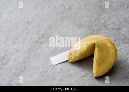 Fortune cookie on gray stone background. Copyspace Stock Photo