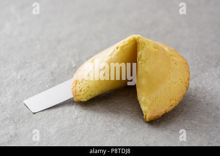 Fortune cookie on gray stone background Stock Photo
