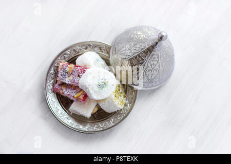 Traditional Turkish sweets lukum on silver saucer with lid Stock Photo