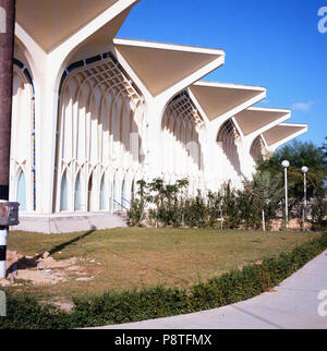 1960s, Dhahran International airport terminal building at Dahran, Saudi Arabia. This was the first airport built in the country. The terminal building was designed by Minoru Yamasaki, completed in 1961 and is architecturally is interesting mix of traditional islamic forms with modern influences. Stock Photo